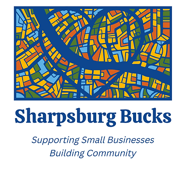  This logo depicts a stained-glass window with a heart and a blue river running through it. The text reads Sharpsburg Bucks: Supporting small businesses, building communities.