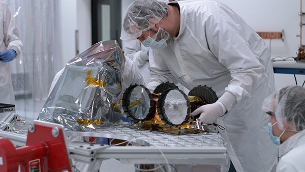  A photo of a member of the Iris team working on the rover as it is secured to the payload deck.